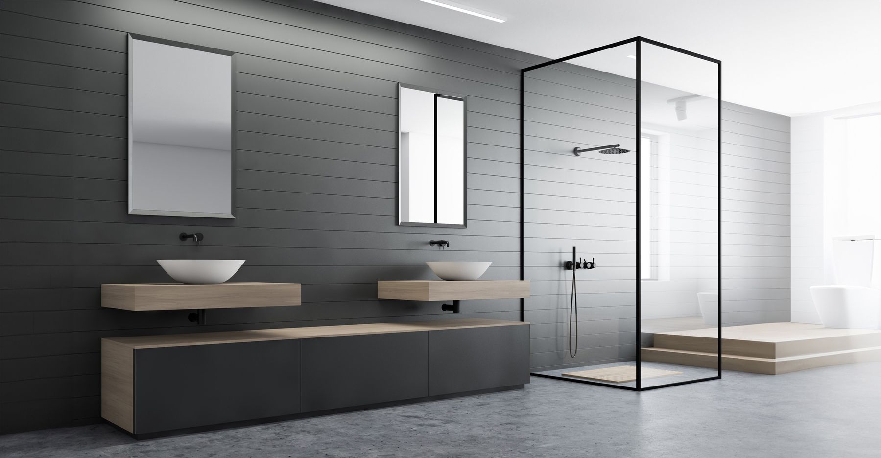 Moderne Badezimmereinrichtung mit einer Glasdusche, zwei Waschbecken, Spiegeln und einer Badewanne.
